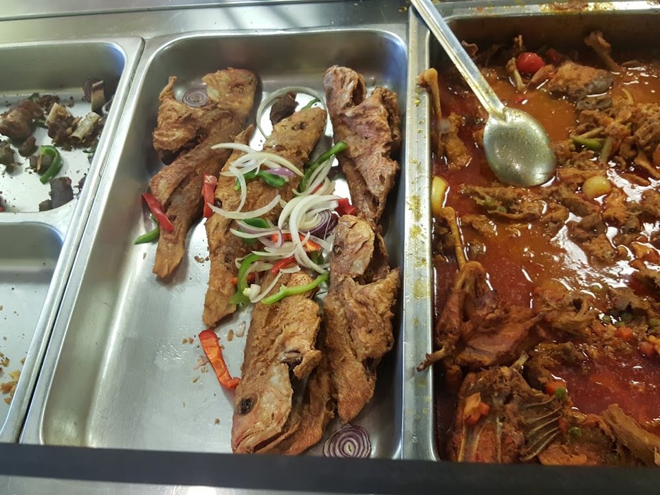 Printed menu with Haitian dishes and beverages